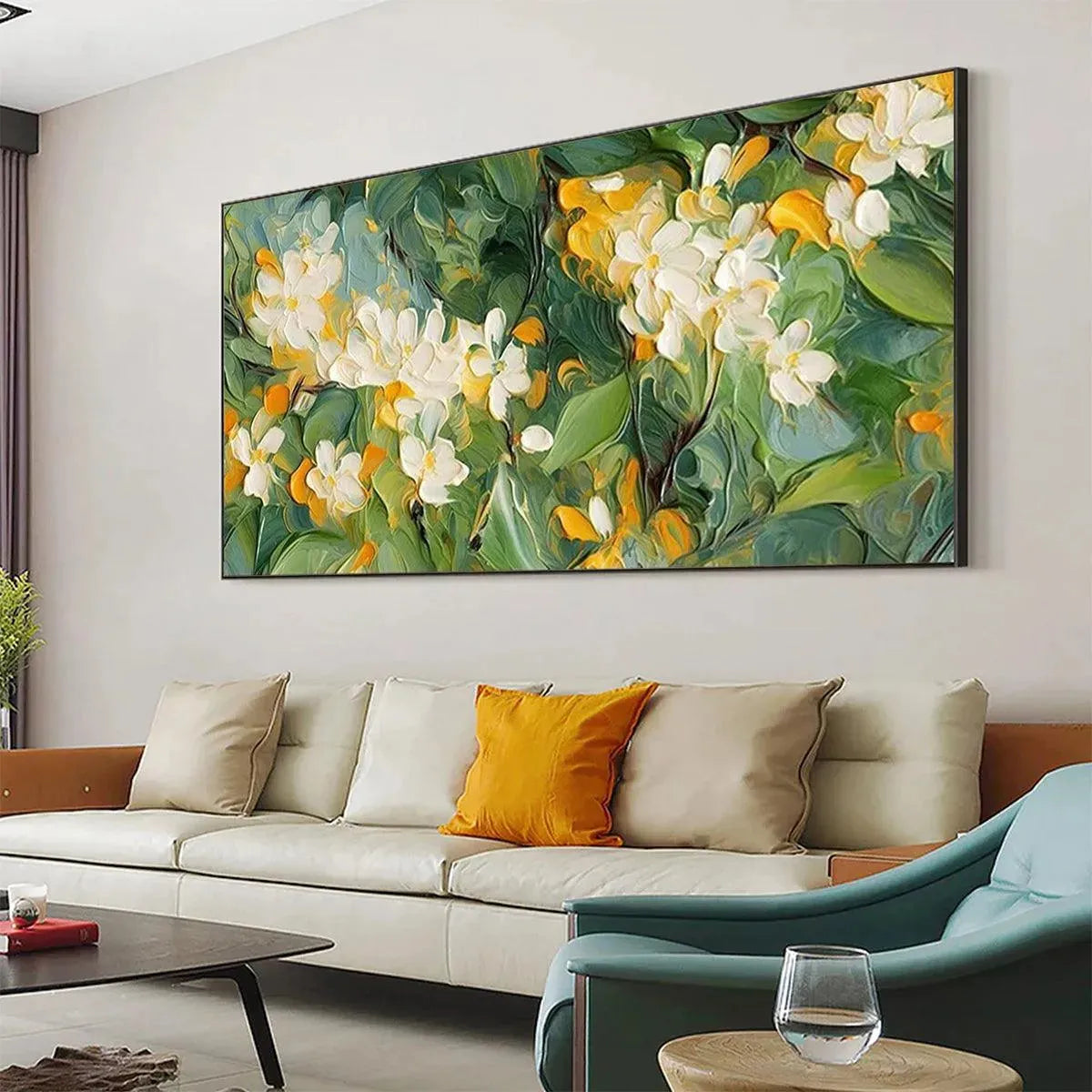 Textured impressionist painting of white orange blossoms above a cream sofa, vibrant green foliage, panoramic wall art