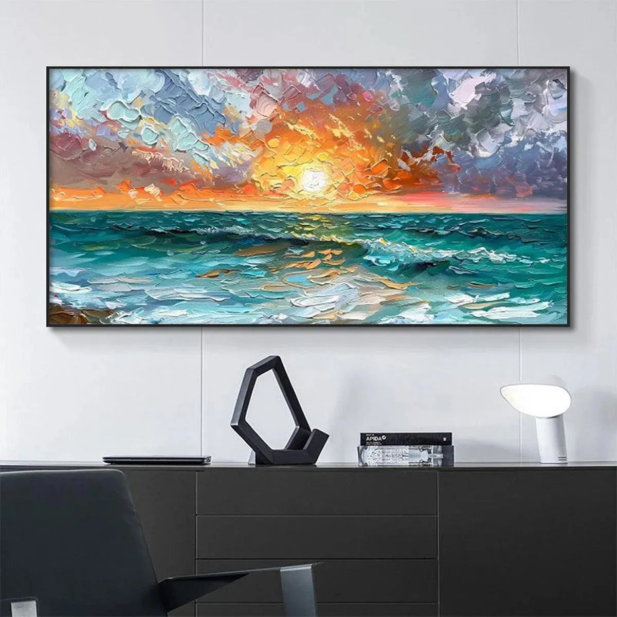 Textured impasto ocean sunset painting, vibrant colors, framed, displayed in a modern room.