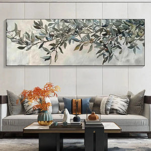 Liam O'Connell's Olive Branch Panoramic botanical painting displayed above a light gray sofa in a room setting.
