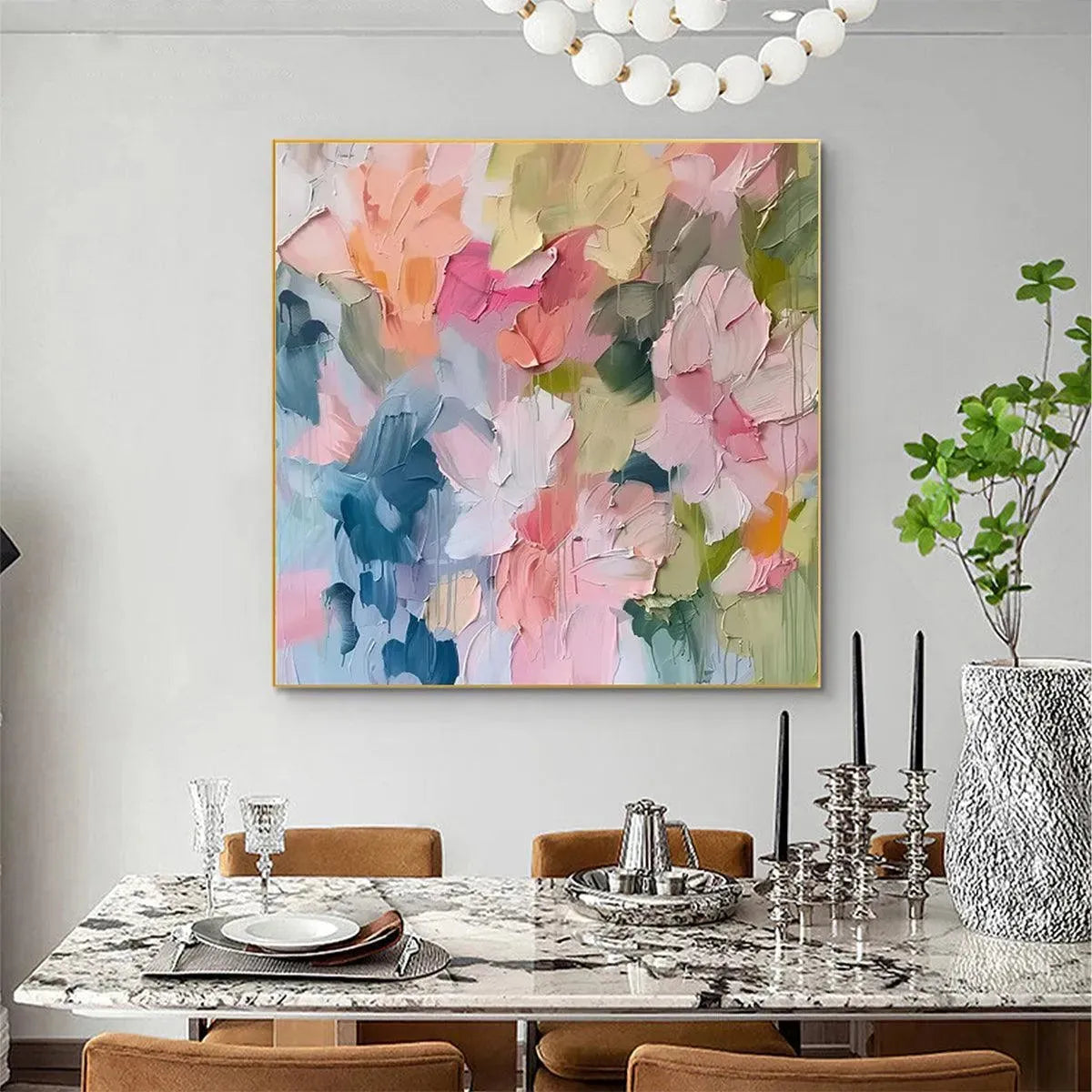 PASTEL DREAM textured abstract floral painting in soft pastel colors, gold frame, displayed in a dining room.