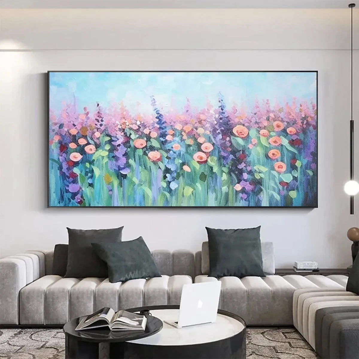 Elodie Dubois' Pastel Meadow artwork: Impressionistic floral painting complementing a modern living room's grey sectional.