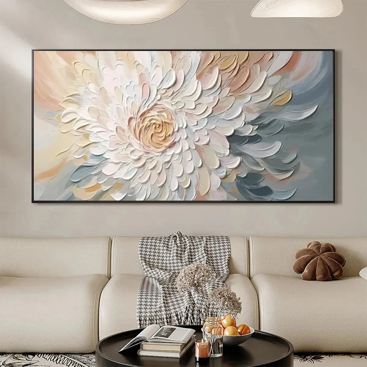 Petal Whirl textured floral painting with swirling neutral petals and golden center in black frame above modern sofa.