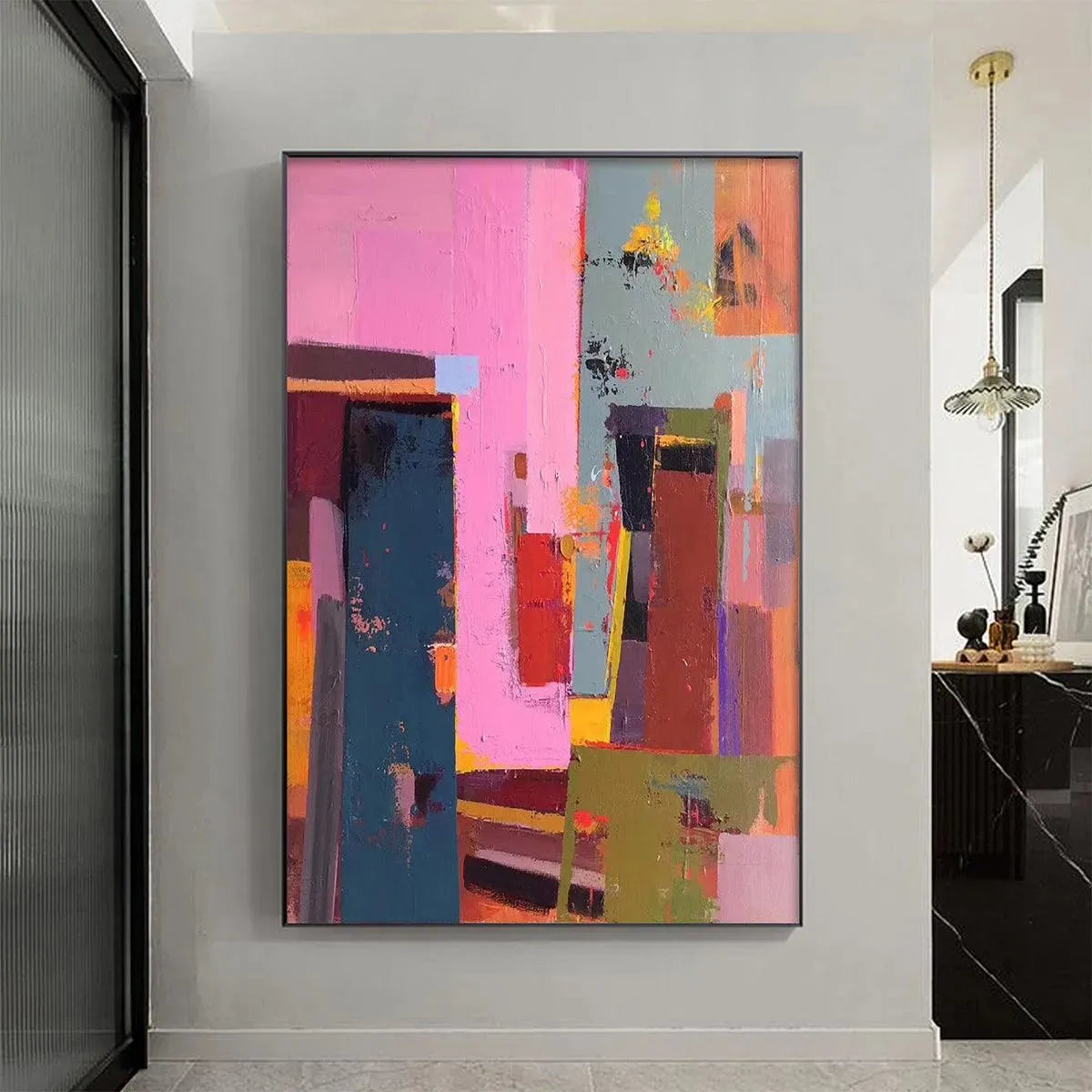 Pink City Abstract by Willow Davies, vertical wall art with pink, teal, red, and brown colors, framed.