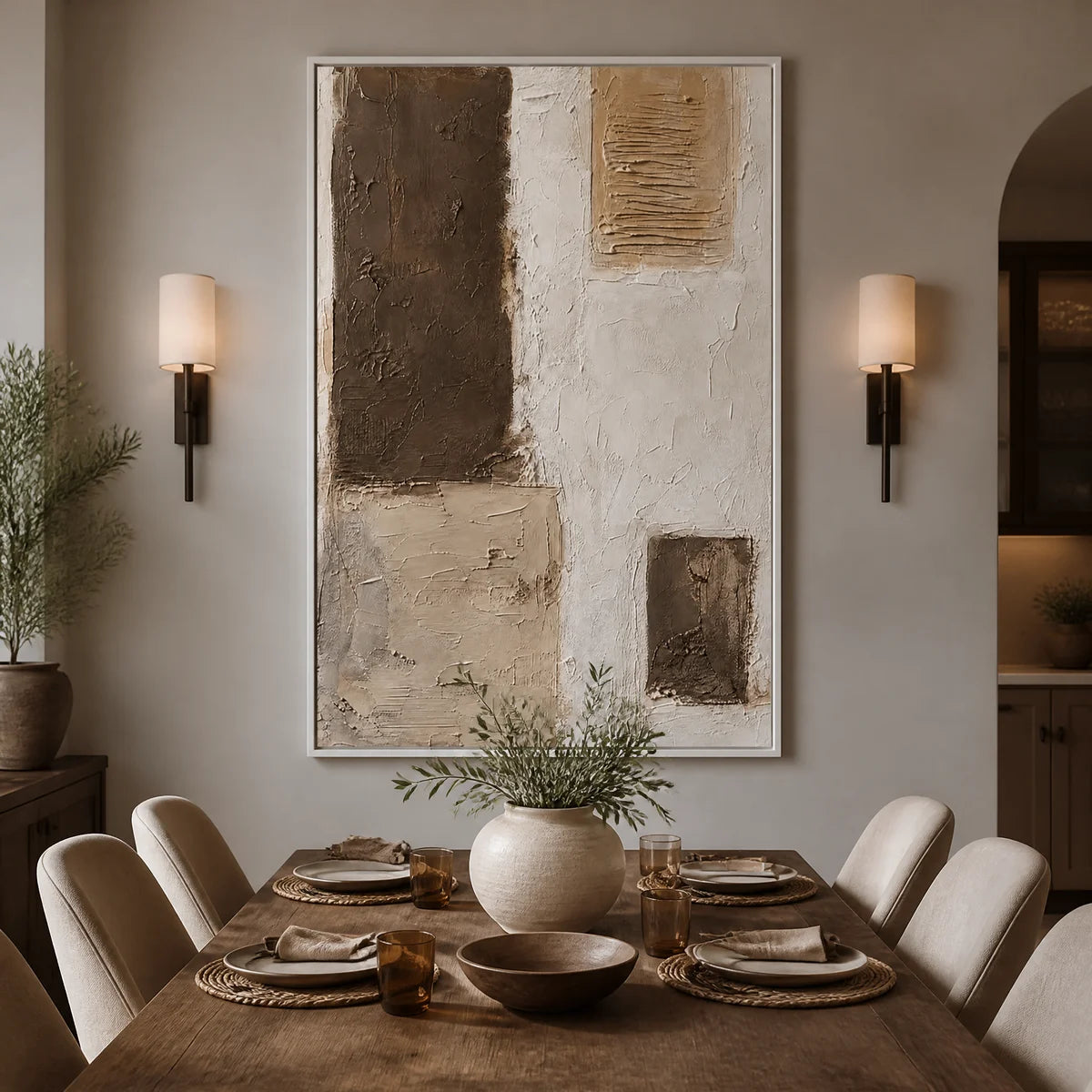 Neutral block texture abstract wall art with earthy beige and brown panels in a white frame displayed in a refined dining room.