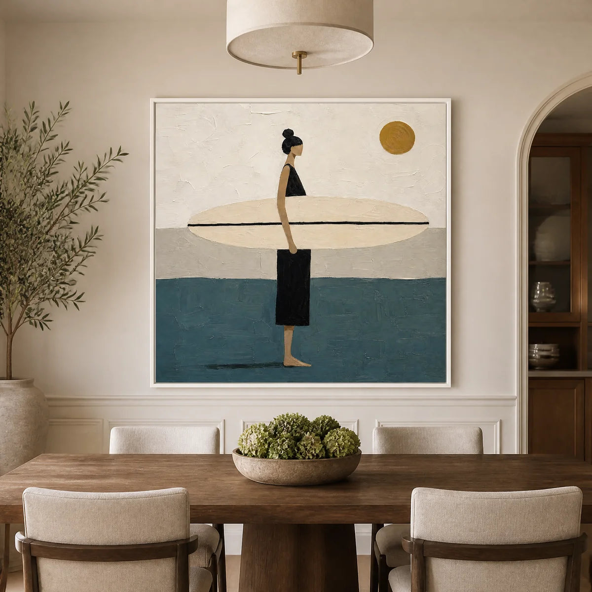 Minimalist surfer wall art with beige, blue and gold tones in a modern dining room.