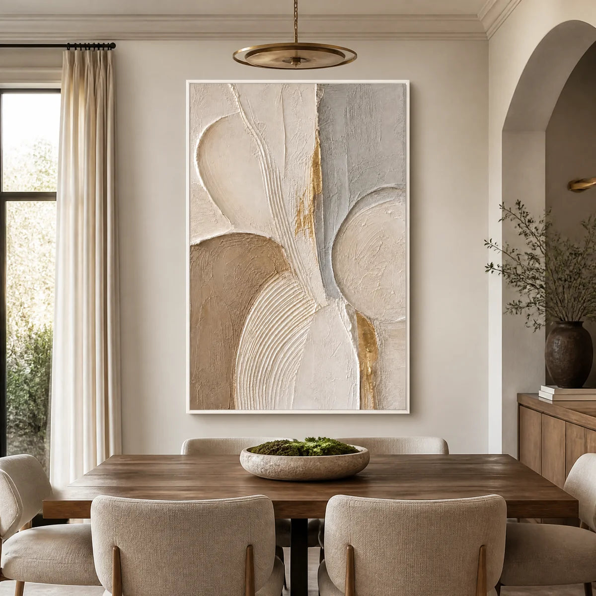 Modern abstract textured painting in white frame, hanging in a bright dining room.