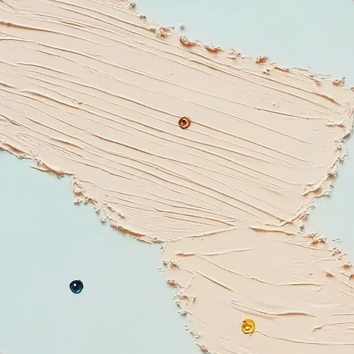 Modern wall art: Textured blush pink impasto painting with playful gold and blue accents.