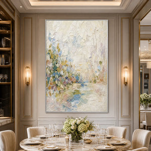 Textured abstract landscape oil painting in soft cream, blue, and gold tones in a luxury dining room