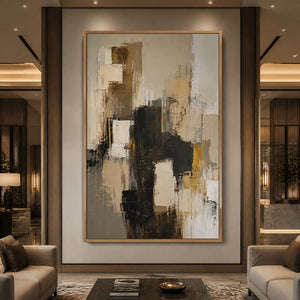 Neutral black gold abstract wall art in a wood frame displayed in a luxury hotel lobby.