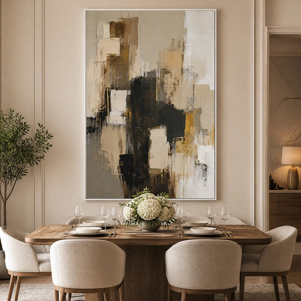 Neutral black gold abstract wall art in gold frame above a modern luxury sofa.