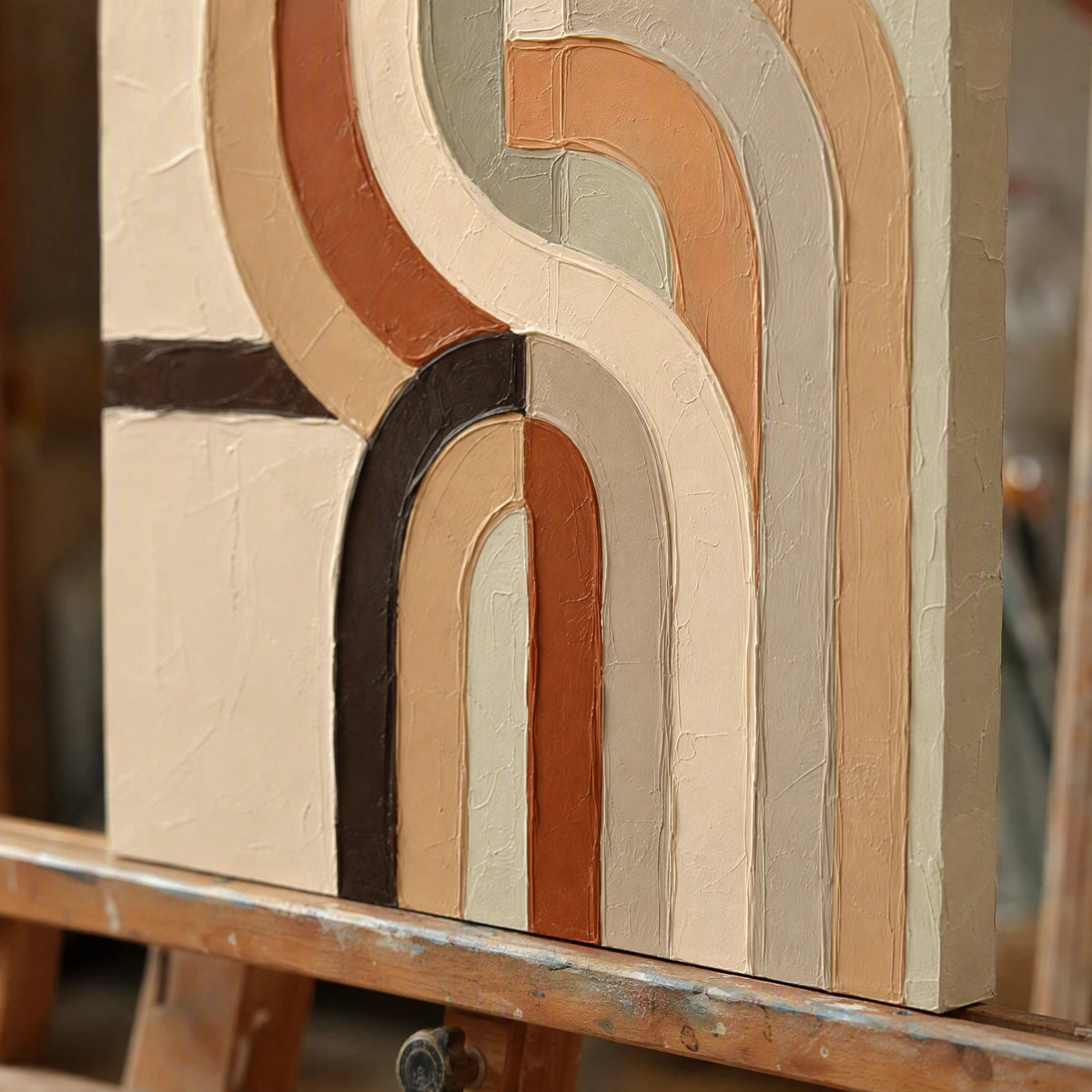Close-up detail of Earthen Loops showing hand-painted texture and part of the frame