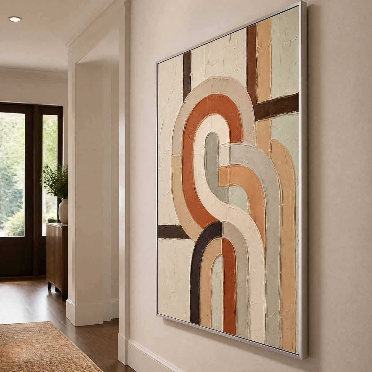 Earthen Loops in a refined entry hall with silver frame