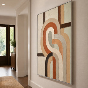 Earthen Loops in a refined entry hall with silver frame