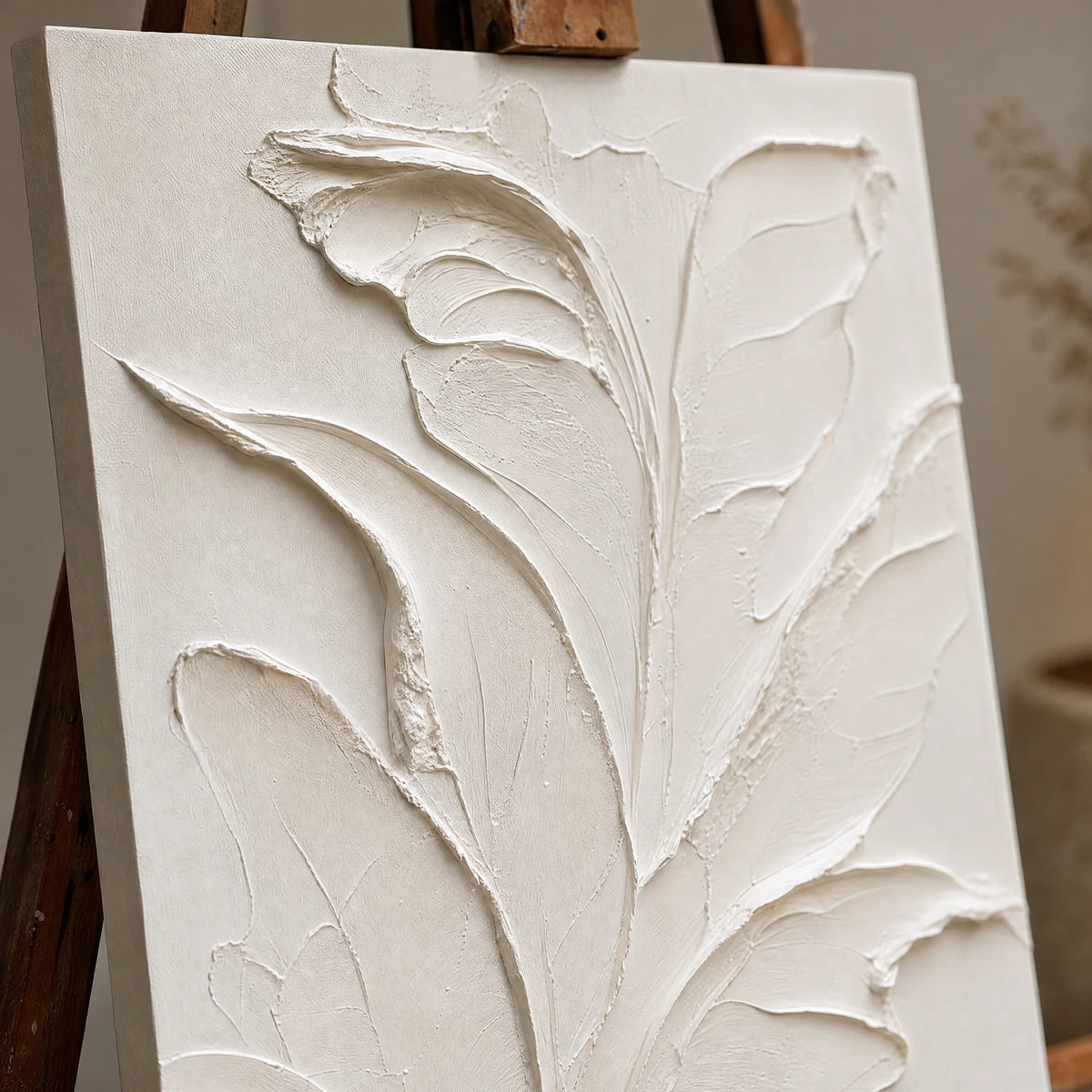 Close-up detail of Ivory Botanical Relief showing hand-painted texture and part of the frame