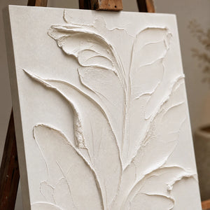 Close-up detail of Ivory Botanical Relief showing hand-painted texture and part of the frame