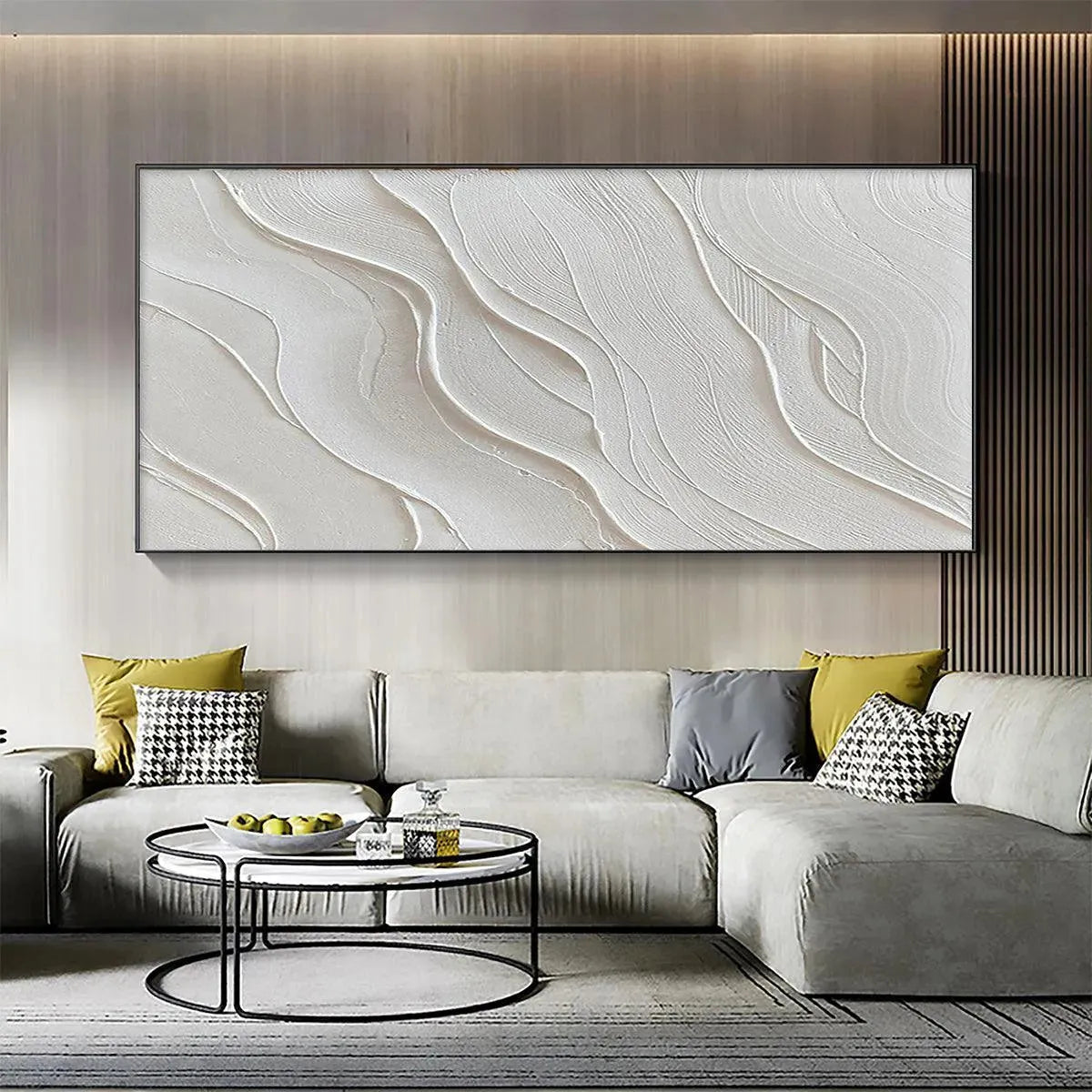 Serene Ripples textured white abstract painting above gray sectional sofa in modern living room.