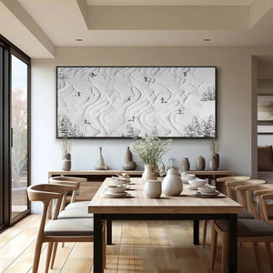 SNOWY CARVE painting, winter landscape by Liam O'Connell. Skiers on textured white slopes. Wall art in a dining room setting.