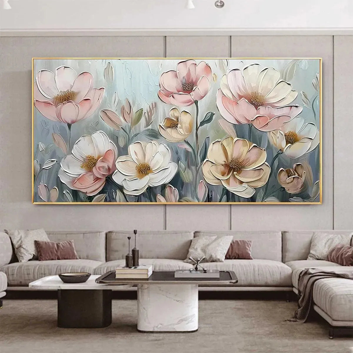 Textured impasto painting of pink and white blossoms displayed in a modern living room above a sectional sofa.