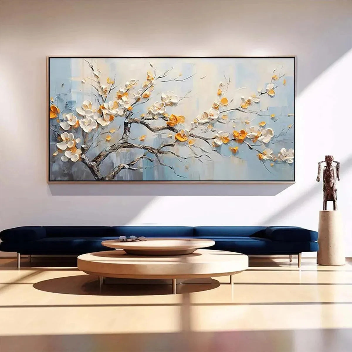 SPRING BLOSSOMS textured white & gold floral painting displayed above a navy sofa in a modern living room.