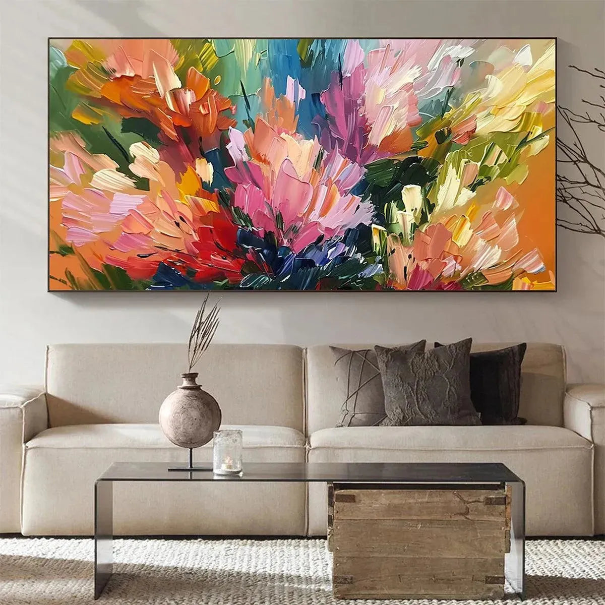 Vibrant 'Summer Bouquet' impressionistic floral painting by Elodie Dubois over a sofa in a modern living room.