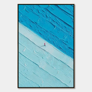 Handmade textured abstract seascape modern wall art with lone red figure.
