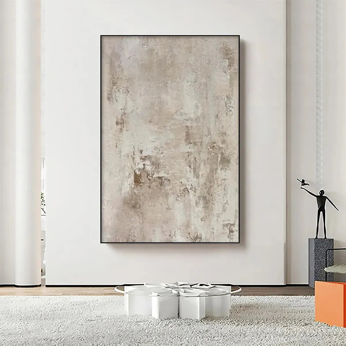 Textured Beige Abstract painting by Javier Ramirez in modern living room, neutral beige tones, black frame, minimalist decor