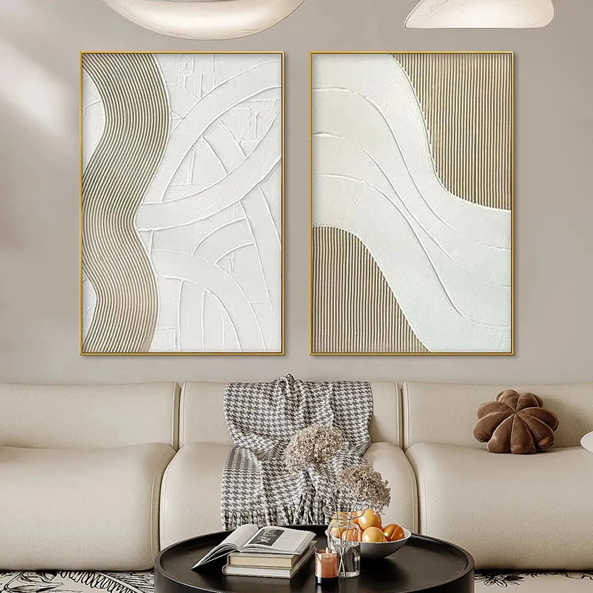 Textured White Lines Diptych: Two gold-framed minimalist paintings with raised white & beige lines above cream sofa.