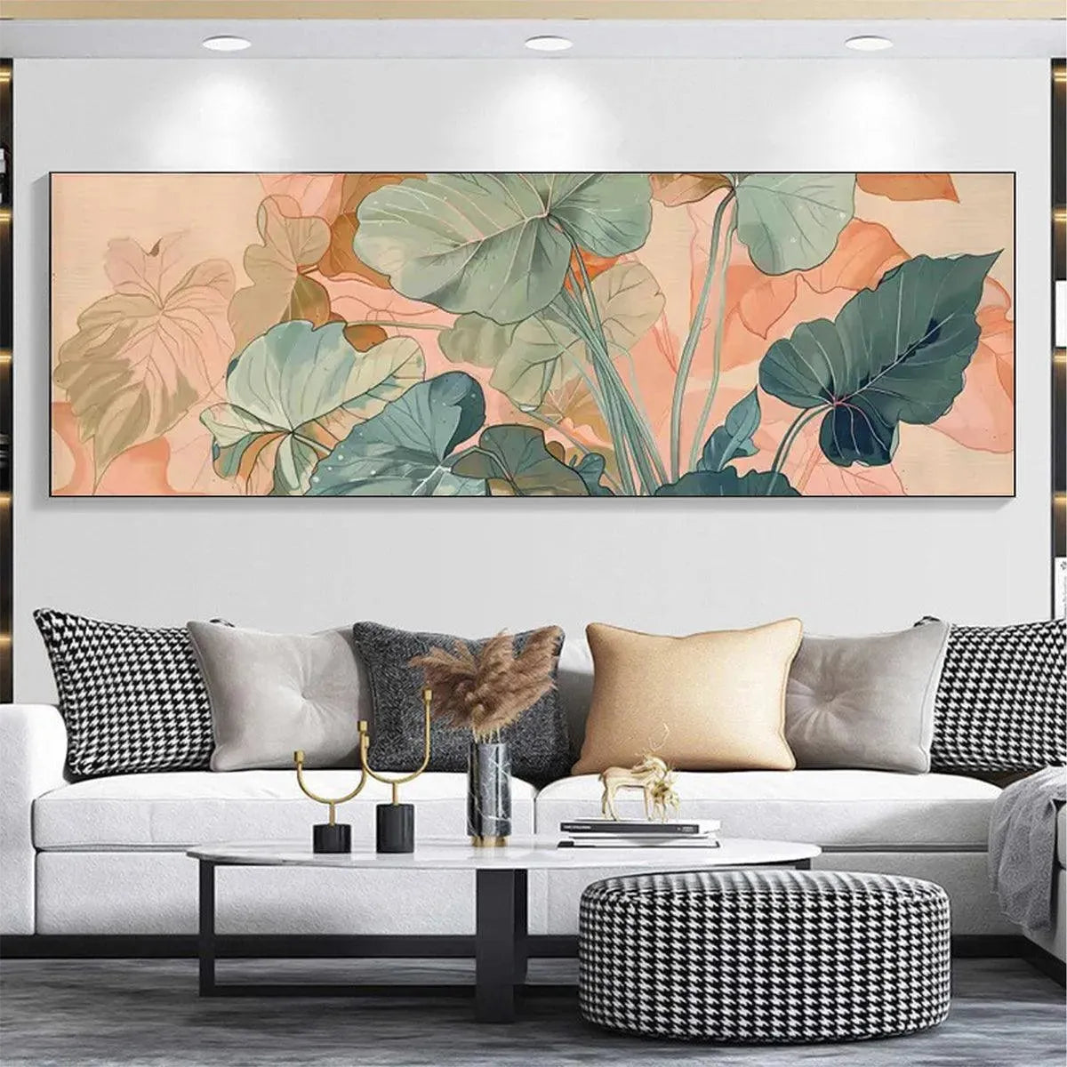 Panoramic botanical painting of teal, sage green, and peach tropical leaves above a white sofa.