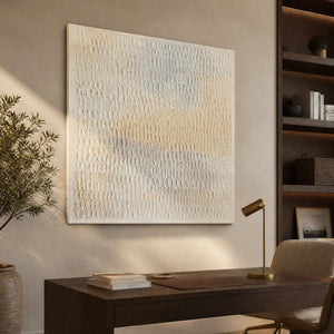 White textured minimalist abstract wall art in a modern office with warm wood accents.