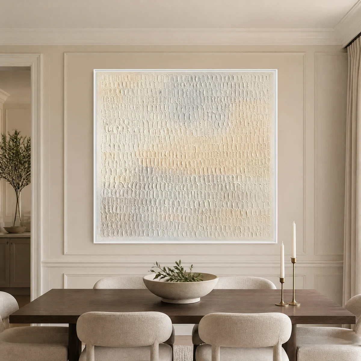 White textured minimalist abstract wall art in a white frame displayed in a refined dining room.