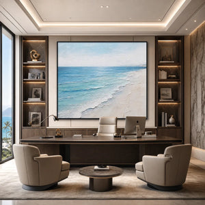 Textured minimalist beach scene painting in blue and white above a luxury office desk