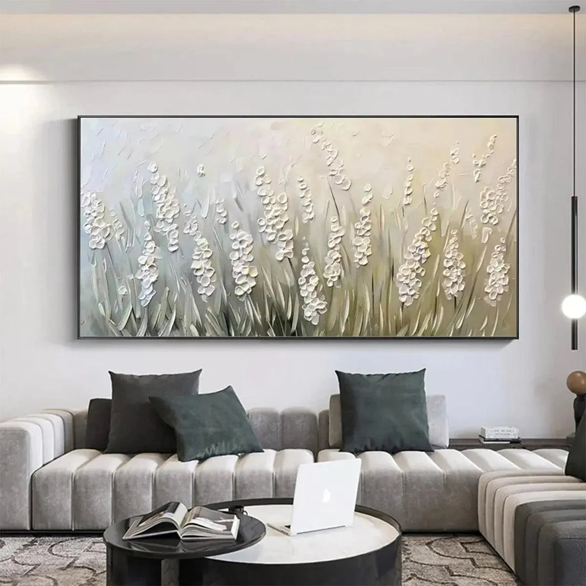 Panoramic textured impasto painting of white flowers above a gray sofa. Serene decor for living room.