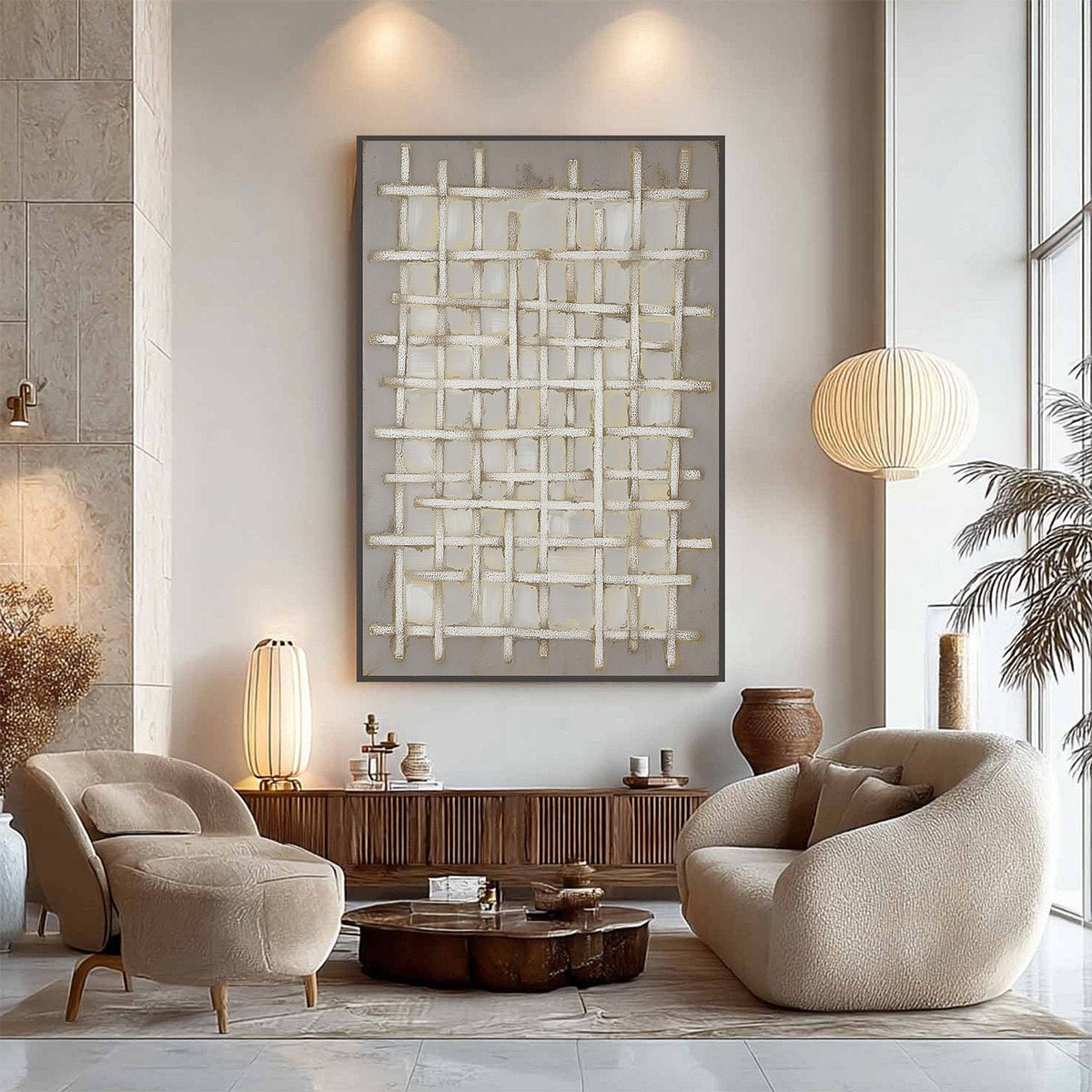 Modern living room with beige chairs, a coffee table, and abstract wall art.