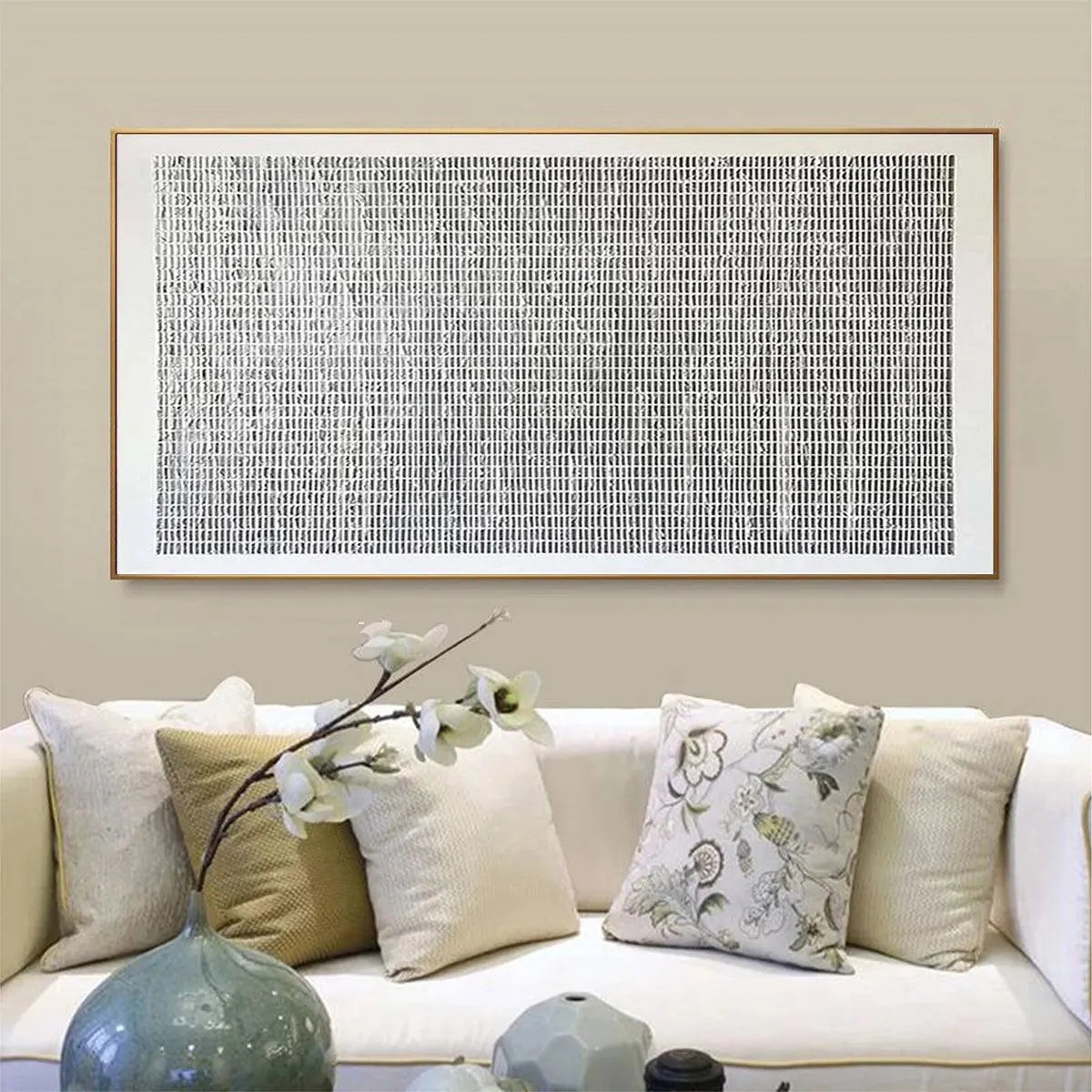 Javier Ramirez woven texture painting, grey and white minimalist art in gold frame, shown in living room.
