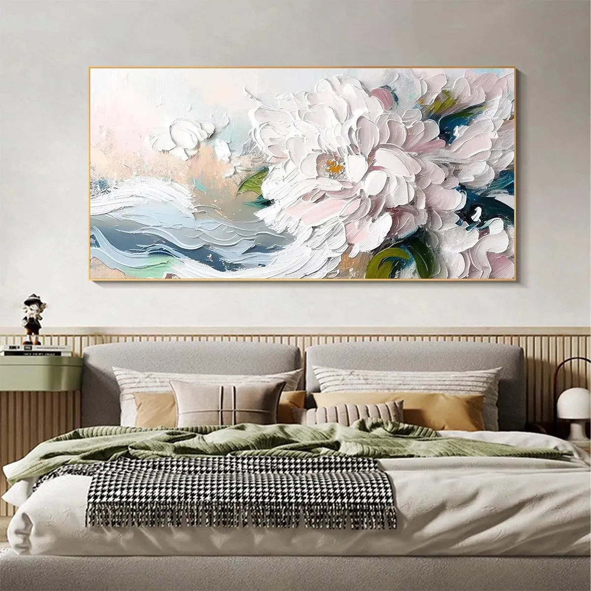 Textured impasto painting of white peonies with soft pink hues, displayed above a bed in a bedroom setting.