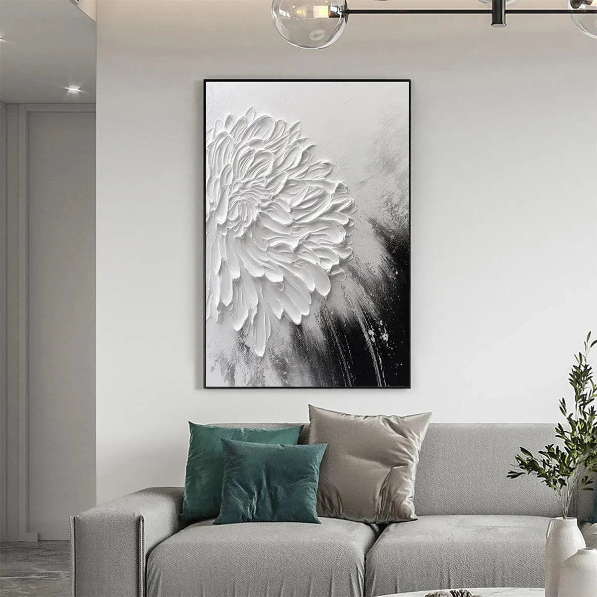 Vertical impasto painting of white bloom, textured petals, black & gray background, shown in room.