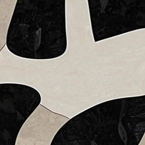 Close-up of Javier Ramirez black & beige diptych: smooth beige organic shapes on textured black background.