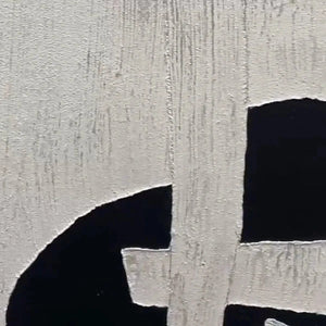 Javier Ramirez black and white abstract. Textured canvas art featuring contrasting geometric forms for modern home decor.
