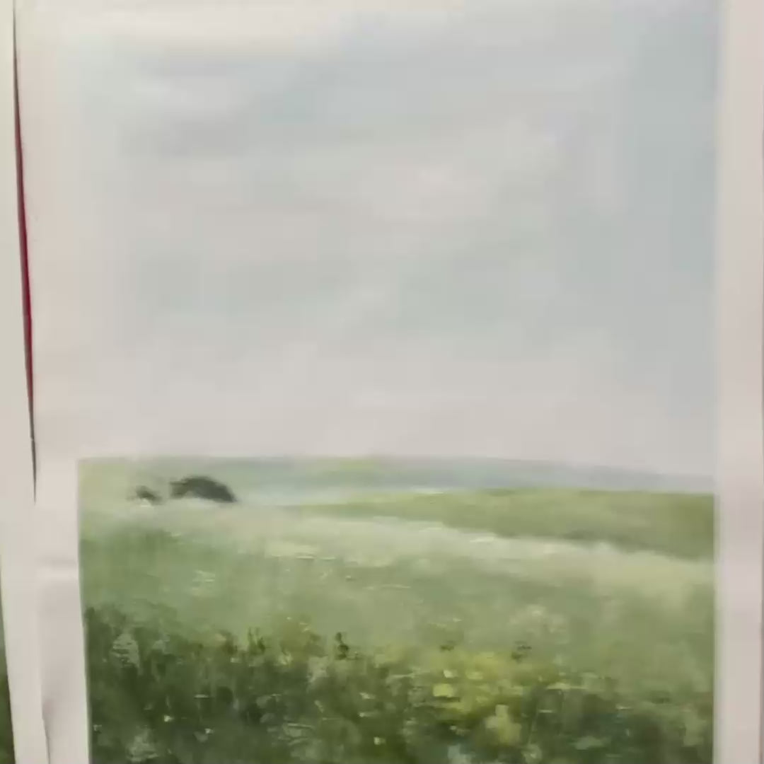 Set of 3 minimalist green field landscape paintings with gold frames, displayed in a modern room setting.